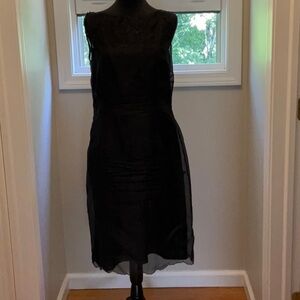 Black laced cocktail dress. With attached slip inside